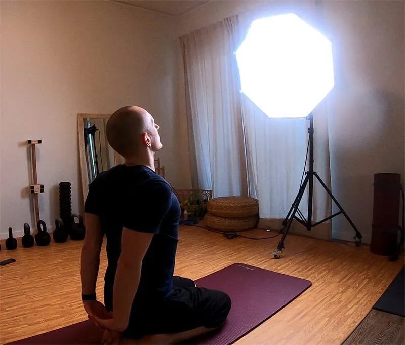 stretching in front of a bright light